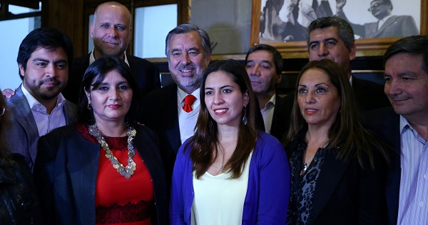 Leftist presidential candidate Alejandro Guillier and members of the Socialist Party pose for the media before a meeting in Santiago.