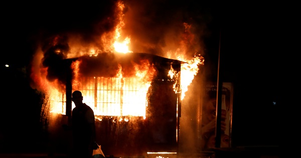 People burned a kiosk in Caracas during a violent protest against the government of President Nicolas Maduro.