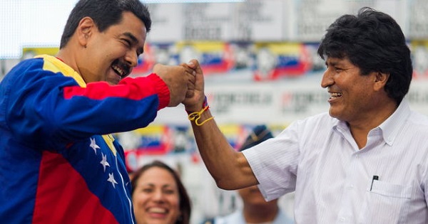 Venezuela's Nicolas Maduro fist bumps Bolivia's Evo Morales.