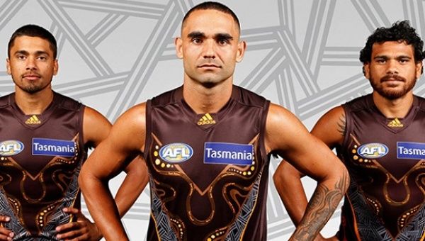 Indigenous AFL players Bradley Hill, Shaun Burgoyne and Cyril Rioli wear the Hawthorn FC Indigenous jersey