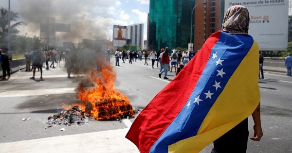 Protesters clash with police in Caracas.