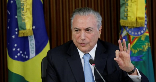 Brazil's president Michel Temer gestures during a meeting of the Pension Reform Commission at the Planalto Palace in Brasilia, Brazil, April 11, 2017.