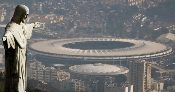 An aerial view shows the Christ the Redeemer statue with the Maracanã stadium in Rio de Janeiro, Brazil, Jul. 16, 2016.