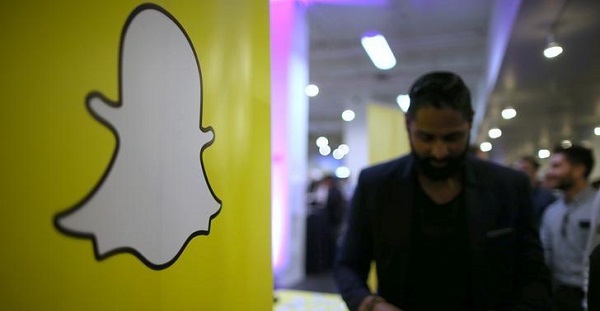 The logo of messaging app Snapchat is seen at a booth at TechFair LA, a technology job fair, in Los Angeles, California.