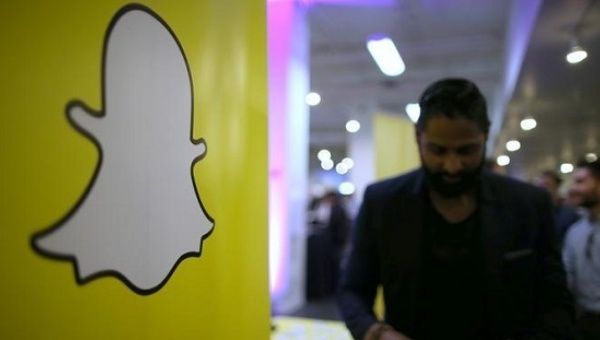 The logo of messaging app Snapchat is seen at a booth at TechFair LA, a technology job fair, in Los Angeles, California.
