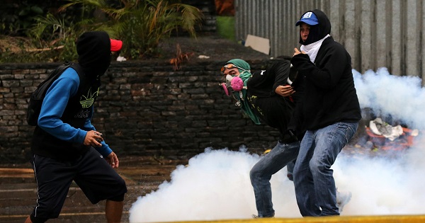 Demonstrators protest in Caracas.