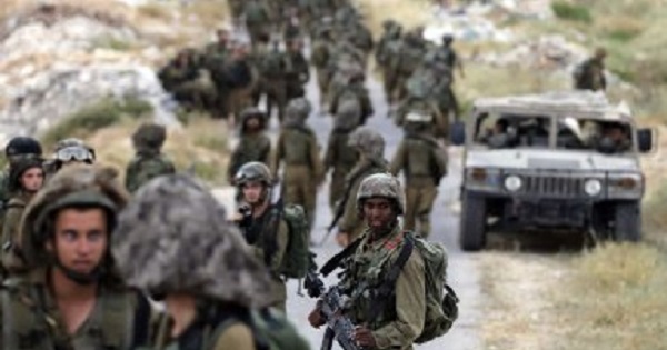 Israeli soldiers patrol near the West Bank City of Hebron.