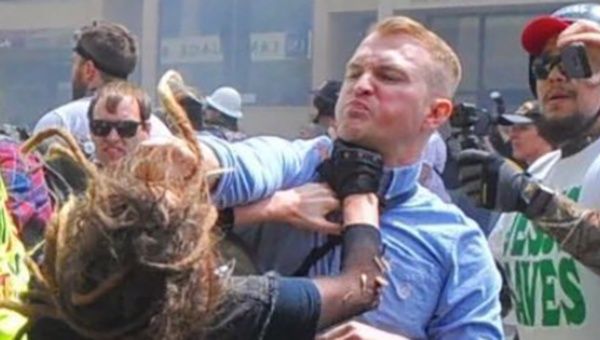 Louise Rosealma being punched by Identity Evropa leader Nathan Damigo.