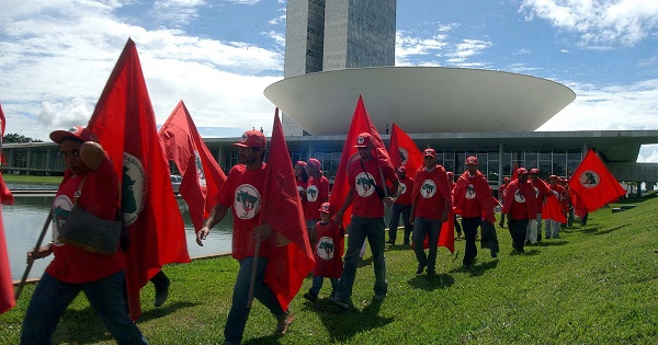 Members of Brazil's Landless Workers' Movement march outside the National Congress.