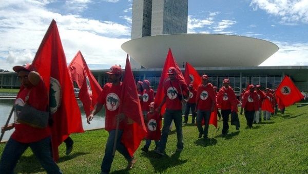 Members of Brazil's Landless Workers' Movement march outside the National Congress.