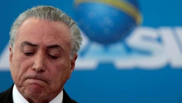 Michel Temer does his best godfather pose.