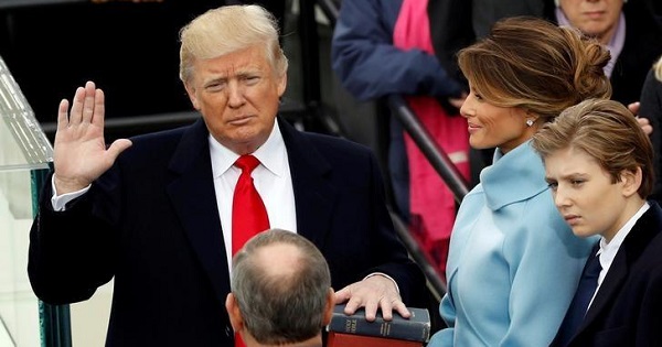 U.S. President Donald Trump takes the oath of office with his wife Melania and son Barron at his side, during his inauguration at the U.S. Capitol, Jan. 20, 2017.
