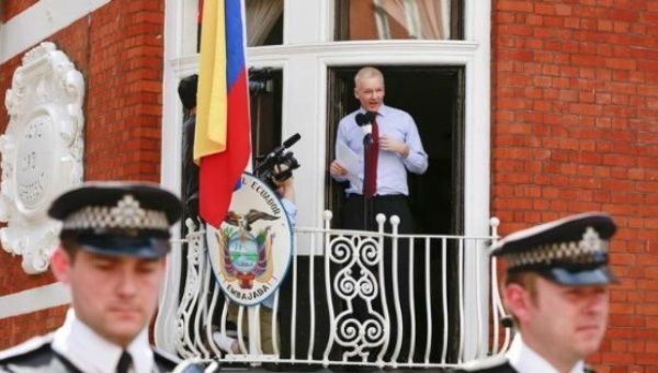 WikiLeaks founder Julian Assange stands outside of the Ecuadorean embassy in London.