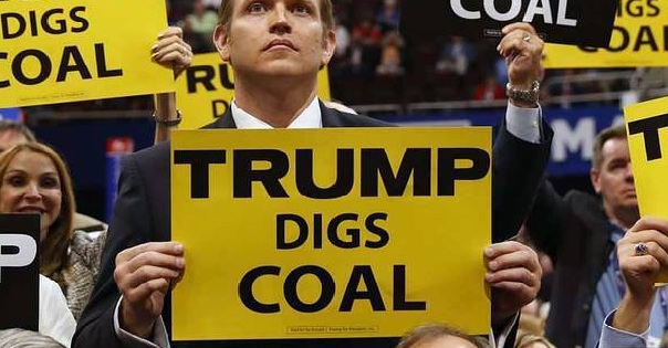 Delegates from West Virginia hold signs supporting coal on the second day of the Republican National Convention in Cleveland, Ohio, July 19, 2016.
