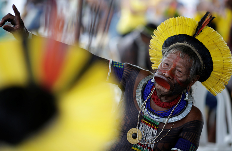 Raoni Metuktire, a leader of the Brazilian Indigenous ethnic Kayapo people, gestures as he takes part in a demonstration against the violation of Indigenous people's rights, in Brasilia, Brazil, April 25, 2017. 