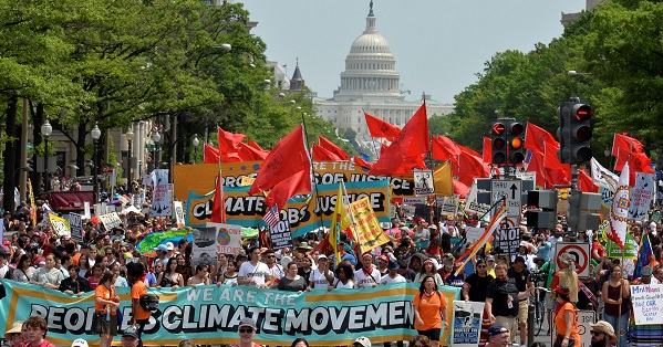 Demonstrators march down Pennsylvania Avenue during a People's Climate March in Washington, D.C., on April 29, 2017.