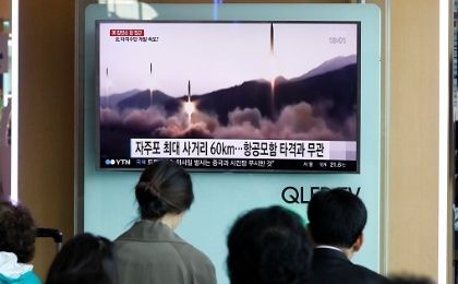 People watch a TV broadcast of a news report on North Korea's missile launch, at a railway station in Seoul, South Korea, on April 29, 2017.