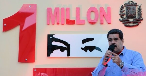 Maduro speaks in front of a silhouette of the eyes of former President Hugo Chavez.
