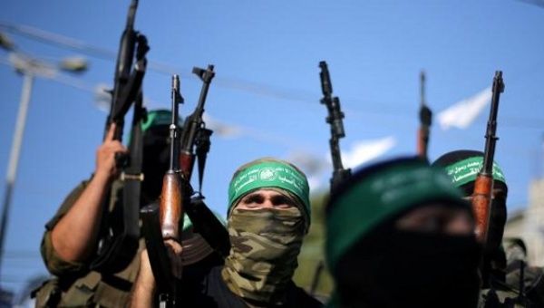 Hamas militants hold weapons as they celebrate the release of Palestinian prisoner Mohammed al-Bashiti, Gaza Strip, July 25, 2016.