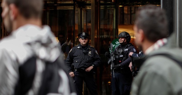 New York City Police Department (NYPD) officers stand guard outside the entrance of Trump Tower in New York City, U.S., April 26, 2017.