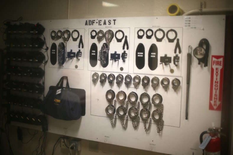 Handcuffs for employees to use are seen at the entrance of the center. More than 1,800 immigrants await hearings or deportation after being arrested by U.S. Immigration and Customs Enforcement agents.