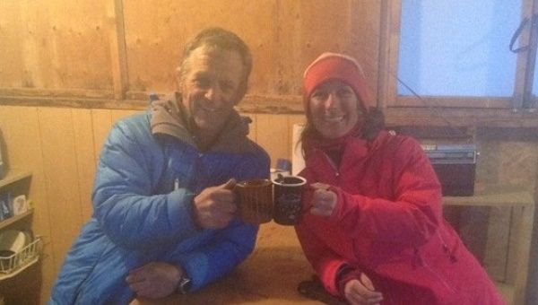 Argentine climber Natilia Martínez (R) celebrates her rescue with Icefield Discovery’s pilot Tom Bradley.