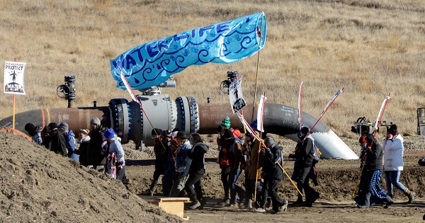 Protesters march along the pipeline route during a protest against the Dakota Access pipeline in St. Anthony, North Dakota, on November 11, 2016.