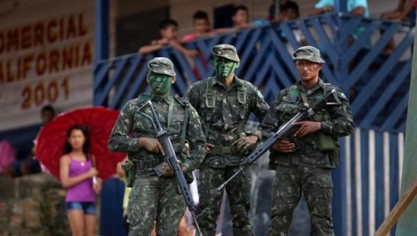 Brazilian soldiers patrol the border with Colombia, in Vila Bittencourt, Amazon State, Jan. 18, 2017. 
