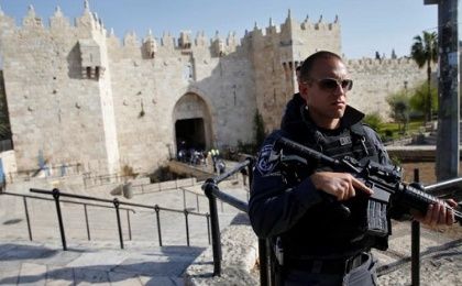 An Israeli policeman stands guard near Damascus Gate in Jerusalem's Old City.
