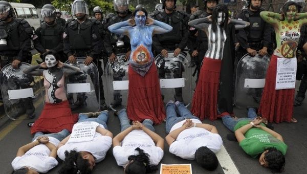 Feminist activists demonstrate in favor of decriminalizing abortion in El Salvador, Sept. 28, 2011.