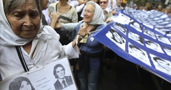 Members of the Mothers of Plaza de Mayo participate in a march in downtown Buenos Aires.