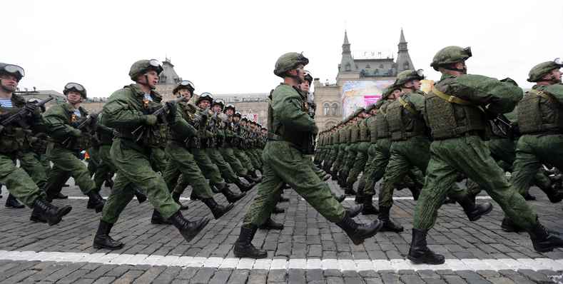 - Russian servicemen march during the Victory Day military parade .