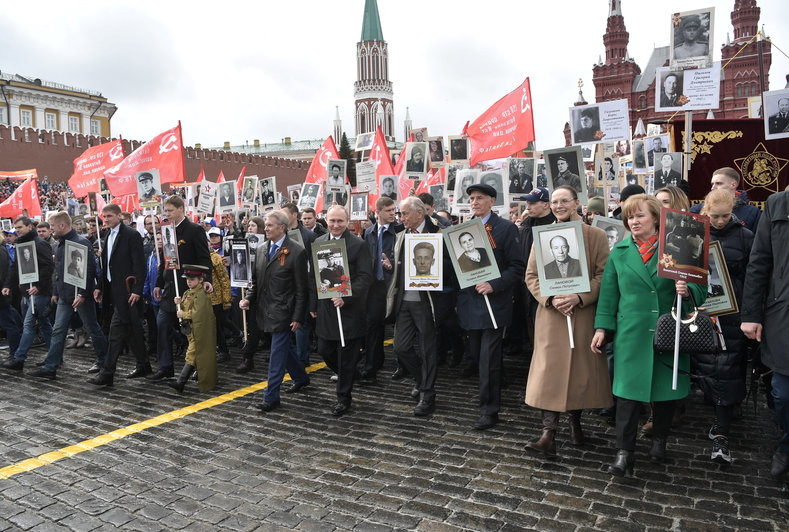 Russian President Vladimir Putin carries the portrait of his father, war veteran Vladimir Spiridonovich Putin, as he attends the Immortal Regiment march during the Victory Day celebrations, marking the 72nd anniversary of the victory over Nazi Germany in World War Two, at Red Square in Moscow, Russia May 9, 2017. 