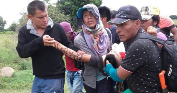 ACIN activists rush an injured man to a hospital after being attacked by Colombian police.