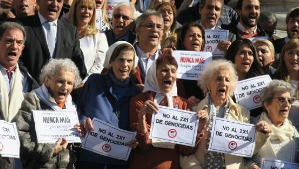 Members of human rights organizations outside Congress in Buenos Aires to celebrate a sanction against the so-called 