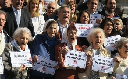 Members of human rights organizations outside Congress in Buenos Aires to celebrate a sanction against the so-called 