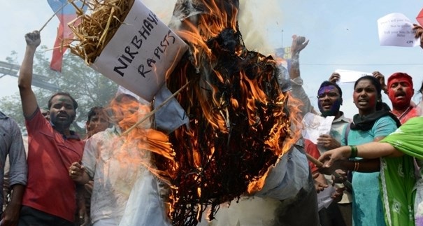 Communist Party of India activists burn an effigy representing the rapists of Delhi student, 