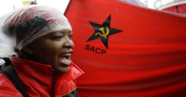 Protester with a South African Communist Party flag