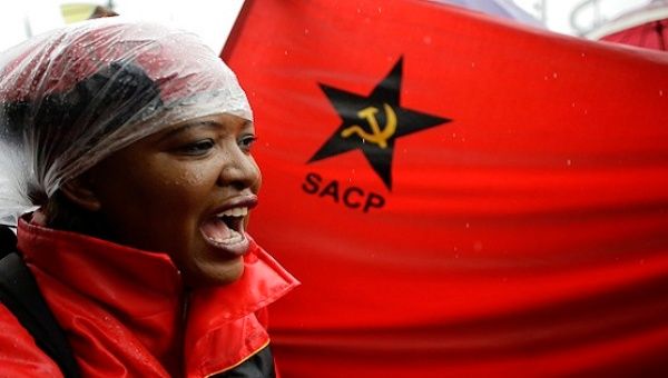 Protester with a South African Communist Party flag
