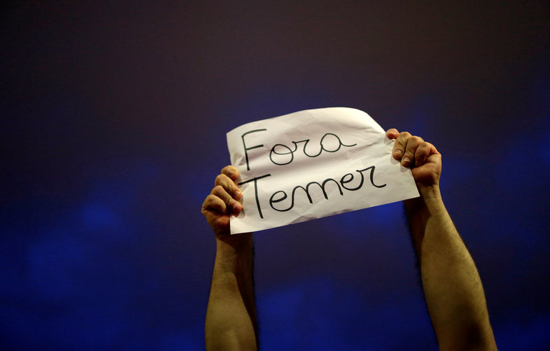 A demonstrator protests against Brazil's President Michel Temer in front of the Planalto Palace in Brasilia, Brazil, May 18, 2017. The sign reads: 