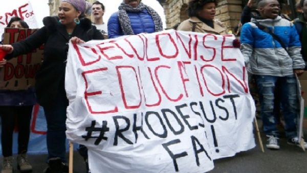 A group of South African students in the United Kingdom march to demand the removal of Rhodes' statue at Oriel College. 