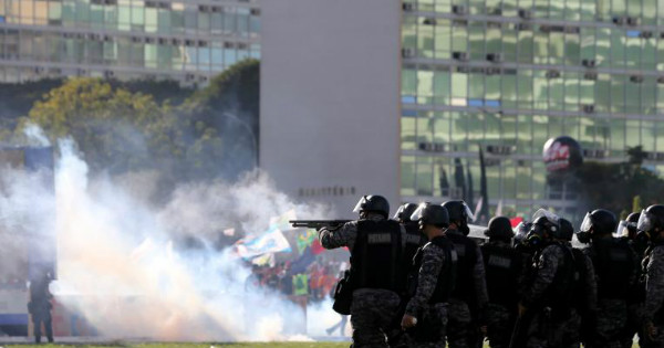 Riot police attack protests against President Michel Temer and the latest corruption scandal to hit the country, in Brasilia, Brazil, May 24, 2017.