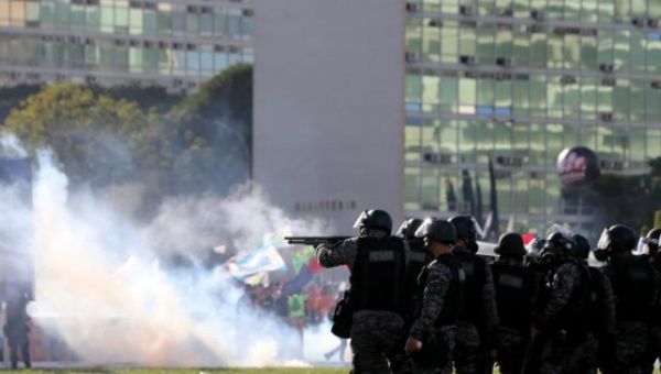 Riot police attack protests against President Michel Temer and the latest corruption scandal to hit the country, in Brasilia, Brazil, May 24, 2017.