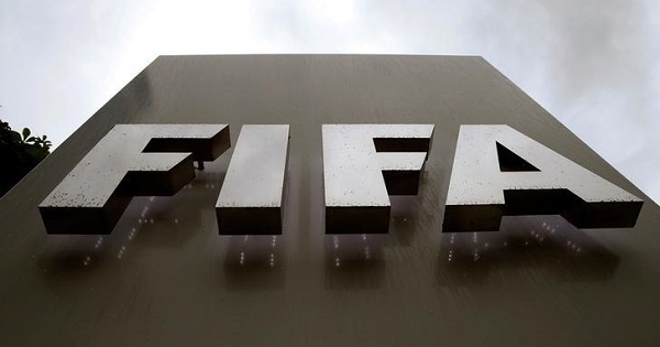 Raindrops flow down on a logo in front of FIFA's headquarters in Zurich, Switzerland June 8, 2016.