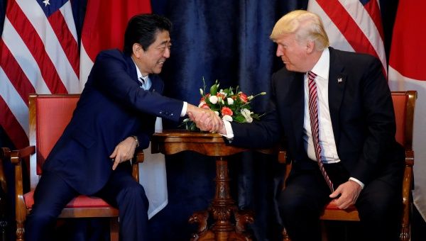U.S. President Donald Trump and Japan's Prime Minister Shinzo Abe shake hands during a bilateral meeting at the G7 summit in Taormina, Sicily, Italy, May 26, 2017. 