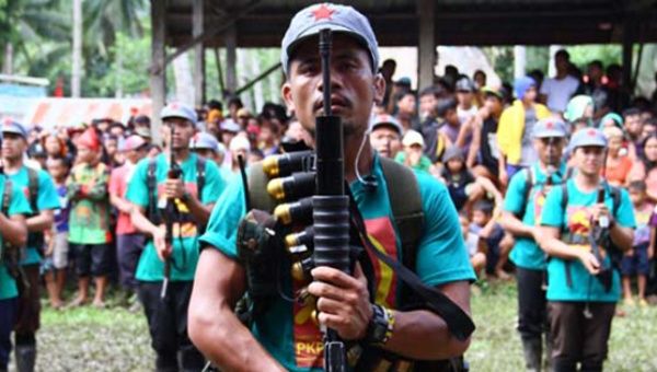 Members of the New People’s Army stand in formation as they mark the 46th anniversary of its founding in a remote village on the southern island of Mindanao, Dec. 26, 2014.