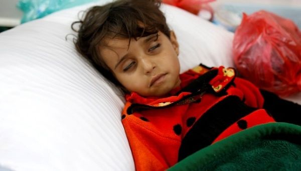 A girl infected with cholera lies on the ground at a hospital in Sanaa.