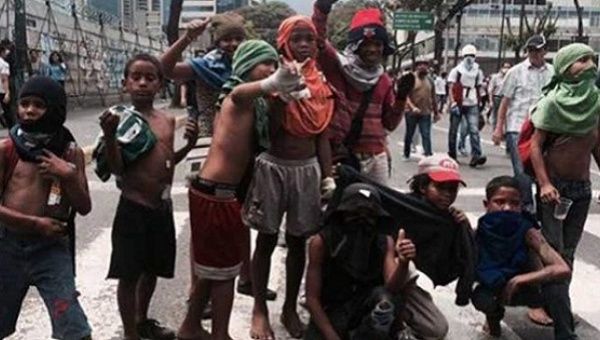 Children taking part in opposition protests in Venezuela.
