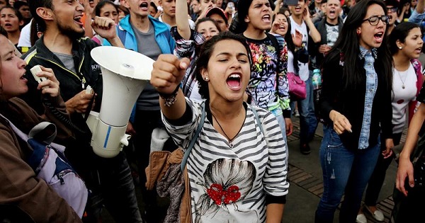 Colombian teachers, accompanied by university students, protest in Bogota to demand education improvements, May 23, 2017.