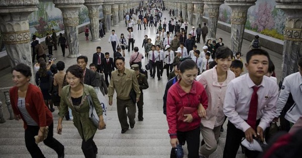 Commuters make their way through a subway station in the DPRK.